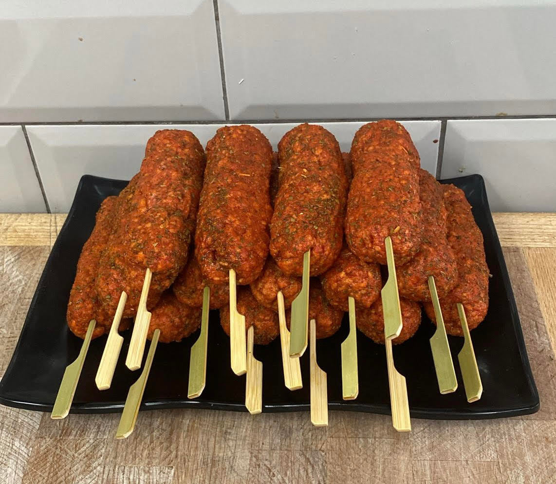 Our famous lamb koftas are now available Supersized! 50% bigger then before!
Made with local lamb and seasoned with cumin, coriander, garlic, salt and pepper. Finished with a mint glaze.