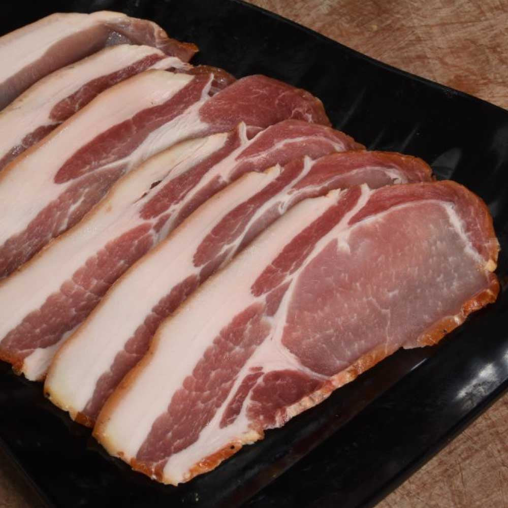 Our Beechwood Smoked bacon made from Free range Gloucester Old Spot Pigs have a wonderful texture, turning amazingly crisp in the pan, with just the right amount of fat for an intense flavour. If you want your bacon with maximum flavour this is the one for you.
Traditionally dry-cured so you won’t lose any of it in the pan.
