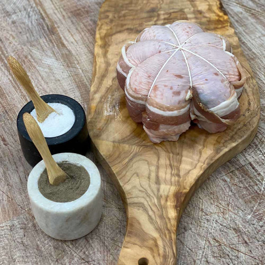 A free range Chicken crown stuffed with a delicious Parsley and Thyme stuffing, then wrapped in Smoked streaky bacon. Partnered with a smooth Chicken, white wine and Thyme Gravy.